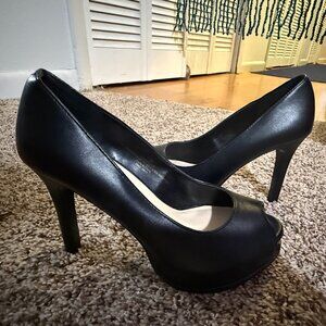 High-heeled peep-toe pumps with a platform sole